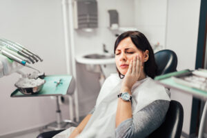 Woman with toothache at dentist office