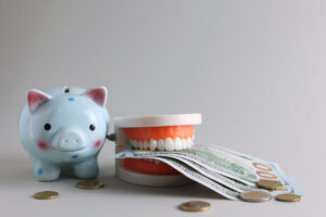 Dental model of teeth and money. The price of dental services. . High quality photo